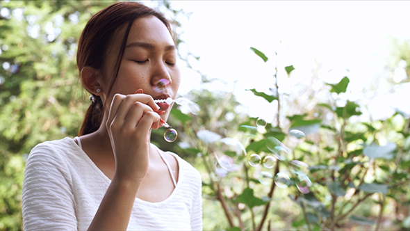 Teenage Girl Blowing Soap Bubbles 02