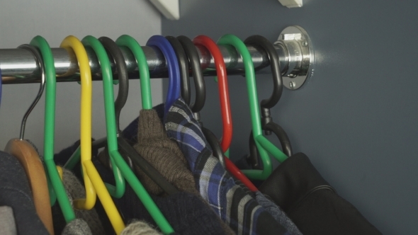 Clothes In The Wardrobe On Hangers