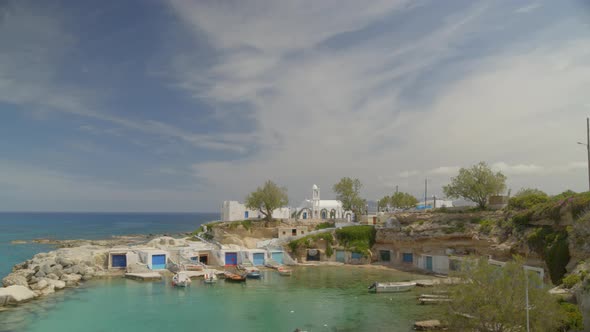 Aerial Pan of Boats Docked on the Fishing Village of Mandrakia in Milos