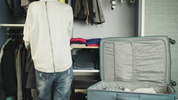 The Woman Packs a Suitcase alt