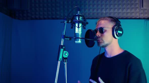 Male Rap Singer Sings Hip Hop in Microphone