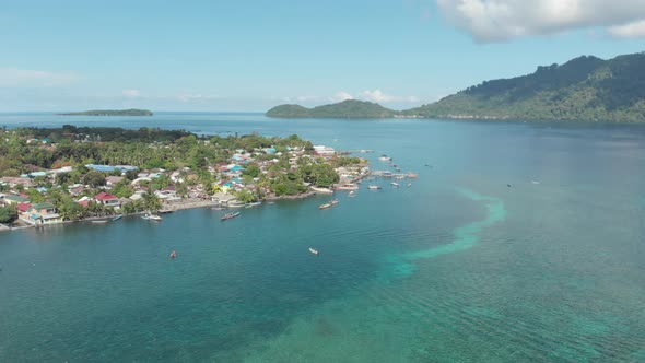 Aerial: kora-kora traditional canoe annual race in Banda Islands Indonesia