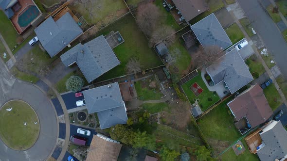 Topdown aerial drone view of houses and backyards in suburban neighbourhood of Kitchener, Ontario.