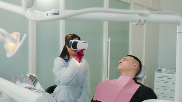 Female Dentist Looking at BP Glasses Xray of Patient