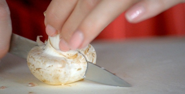 Knife Cuts Mushroom