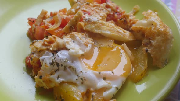 Eating Freshly Prepared Fried Egg with Vegetables