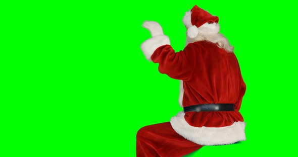 Rear view of santa claus waving hand 4k