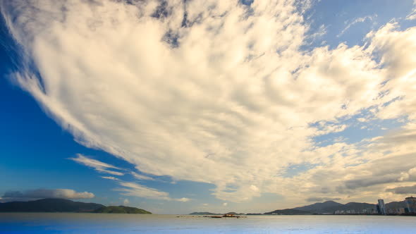 White Cumulus Clouds Motion Over Bay Hills on Skyline