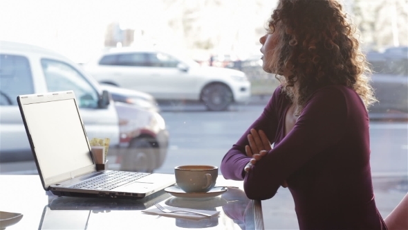 Cute Girl Drinking Coffee On a Cafe In The City