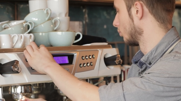 Barista Makes Coffee With a Coffe Machine