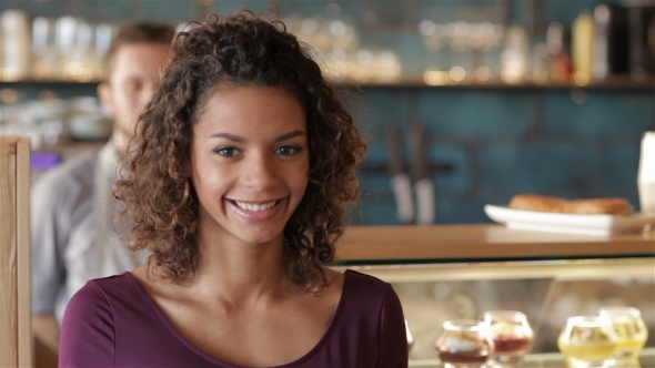 Girl Smiling On The Background Of Male Barista