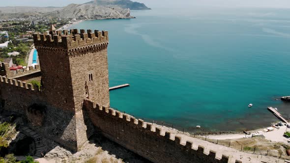 Aerial Around Incredible Stone Towers Wall Genoese Fortress Citadel Mountain Top Bay of Black Sea at