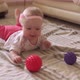 Toddler Funny Playing with Toy Ball on Floor - VideoHive Item for Sale