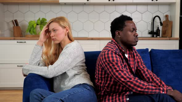 Couple Offended at Each Other Sit on Couch Back to Back Relationship Problems