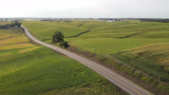 lonely road, transportation and cars passing by in south minnesota, country side