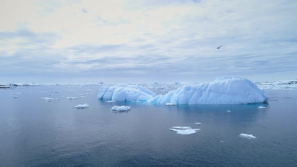 Iceberg Float in Clear Water Ocean Aerial View