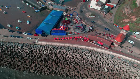 Aerial shot of street and rocks of sea with piegon bath corner in Scarborough UK. Pigeon Bath Corner