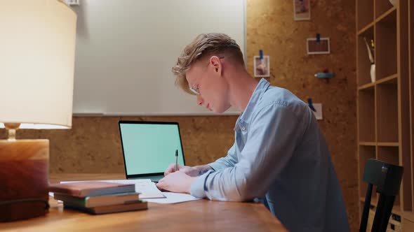 Young Manstudying at Home Gives Up Taking Off Glasses and Lies on the Table