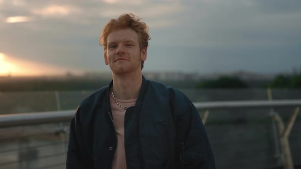 Portrait of Male Hipster in Stylish Casual Outfit Standing on City Street Looking to the Camera