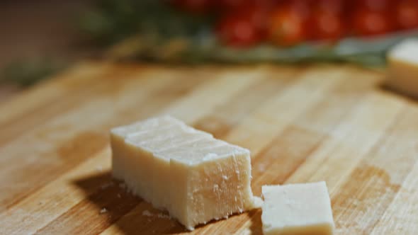 Gnocci with Tomato Sauce Being Sprinkled with Parmesan