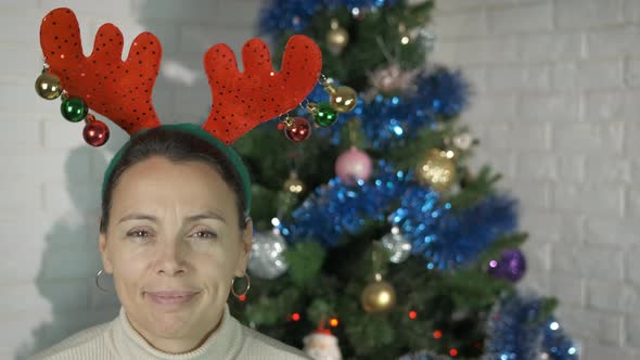 Happy Female Christmas with Antlers on Head