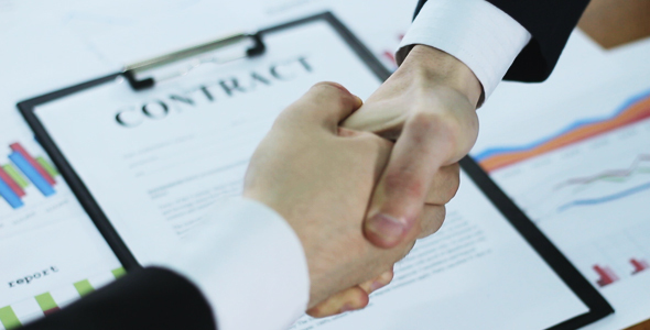 Shake Hands After Signing the Business Contract