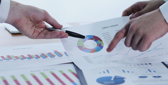 Business People Discussing Business Charts alt