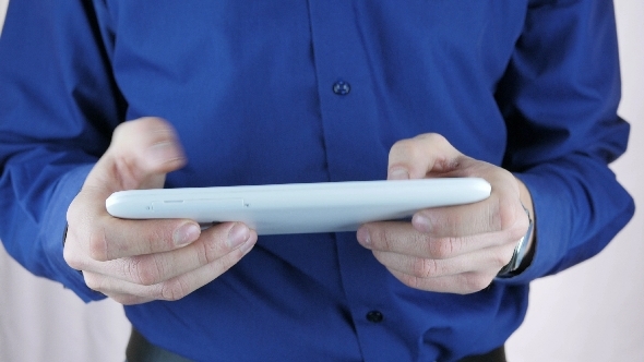 Businessman Playing On Tablet