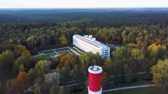 Kemeri Water Tower With Latvian Flag in the Kemeri Resort Park in Jurmala, Latvia. Beautiful White N