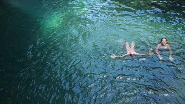Girl Swimming In The Lake
