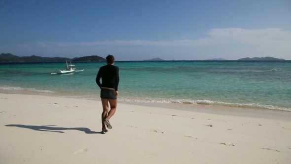 Man Is Running In The Tropical Sea