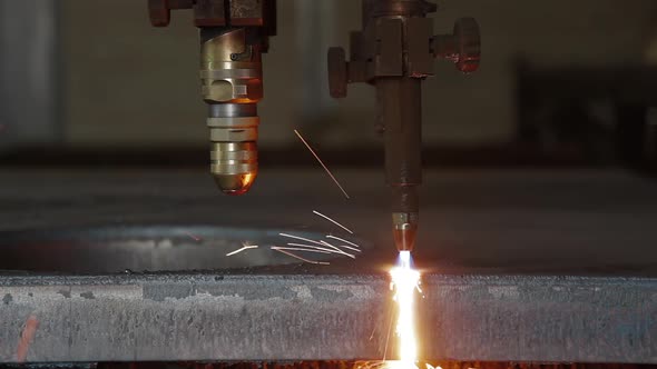 Plasma Cutting of Metal with a Cnc. A Plasma Cutter Cuts a Workpiece From a Sheet of Metal. Laser