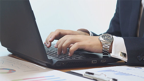 Businessman Working on Laptop alt