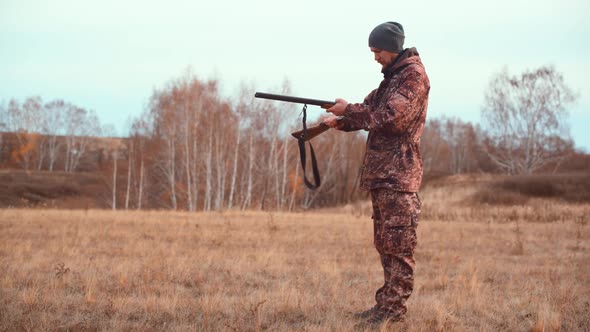 The Hunter Loads the Shotgun on the Hunt