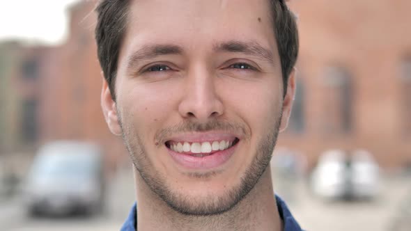 Outdoor Close up of  Smiling Young Man