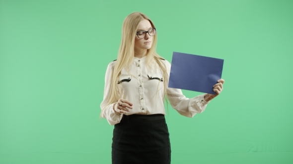 Girl With a Blue Sign On a Green Background