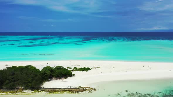 Aerial top down scenery of relaxing seashore beach time by blue green lagoon and white sandy backgro