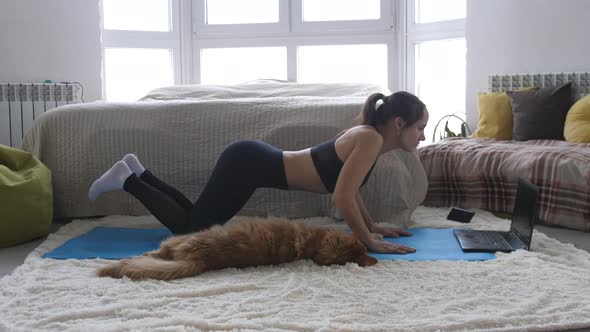 Woman Doing Exercise Workout Online Personal Trainer Watching an Online Course on the Computer and