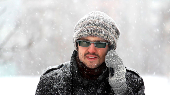 Man Speaks On The Phone In The Winter alt