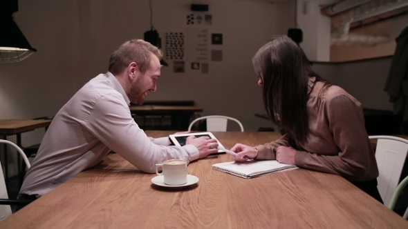 Business People Working With Tablet In Cafe