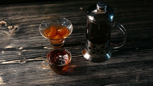 Tea Being Poured Into Glass Tea Cup