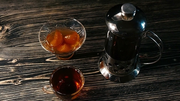 Tea Being Poured Into Glass Tea Cup