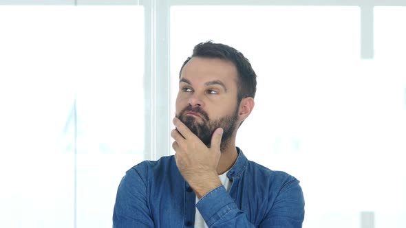 Thinking Creative Man Brainstorming Sitting in Office