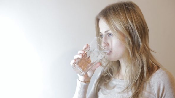 Blonde Woman Drinking Water