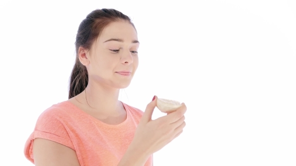 Girl Tries a Slice Of Lemon