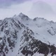 Flight above snowcapped mountains near Elbrus - VideoHive Item for Sale