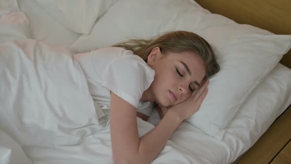 Attractive Young Woman Trying to Sleep in Bed