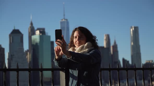 A Beautiful Woman Taking Selfies, Nyc Skyline In Background 1