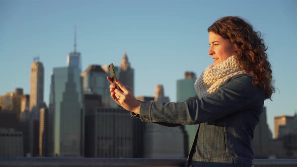 A Beautiful Woman Taking Selfies, Nyc Skyline In Background 7