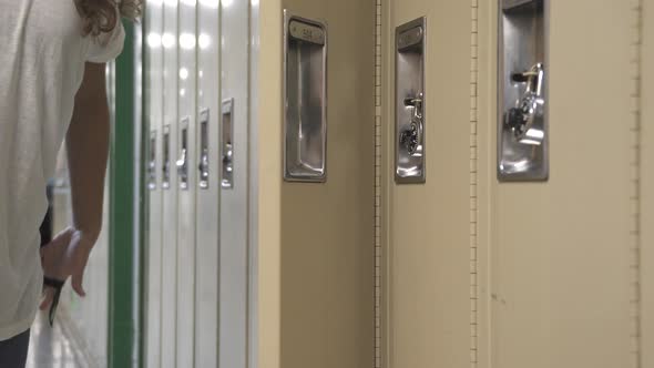 Student Using Her Locker (1 Of 2)